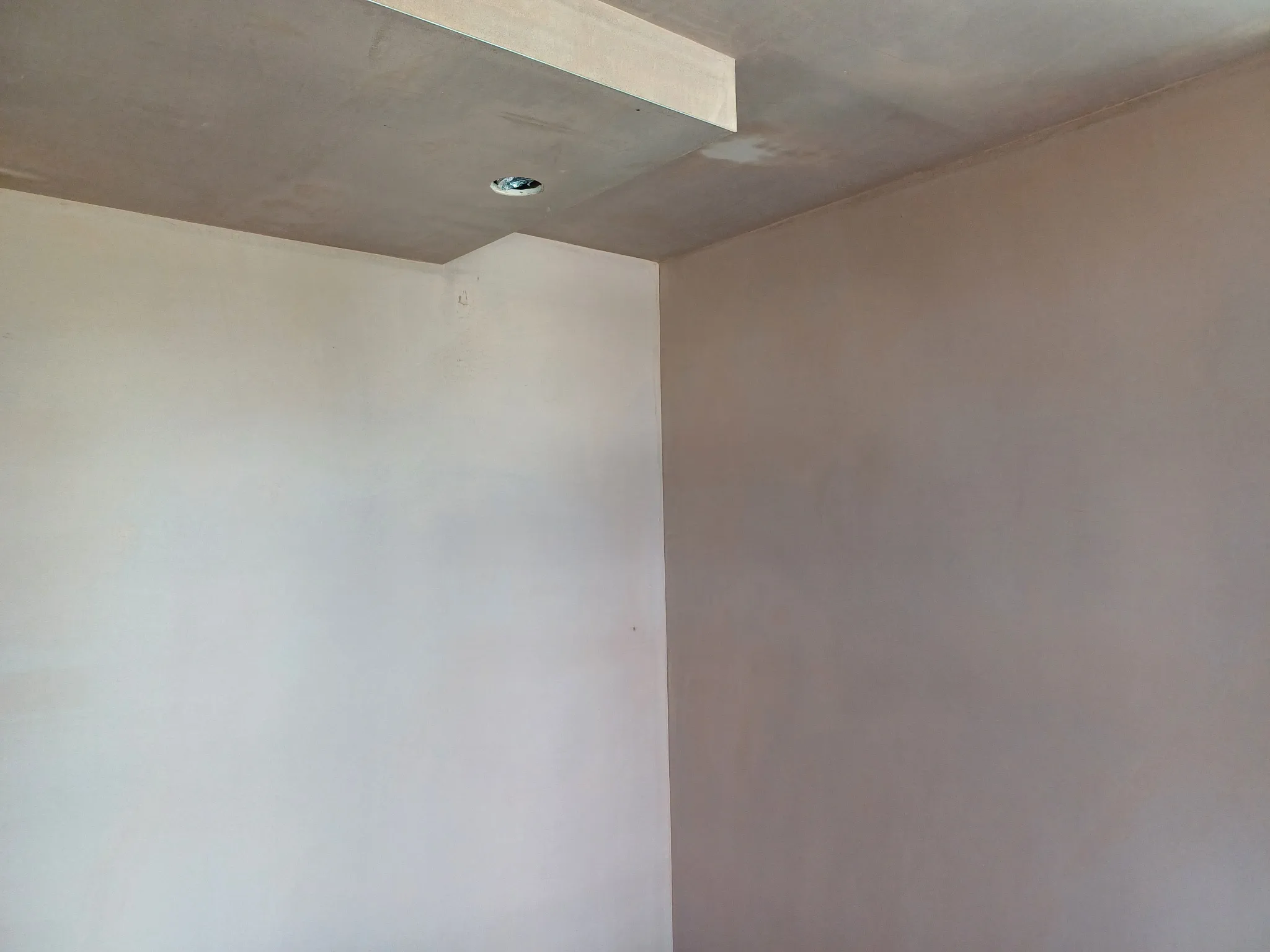 Finished plaster on the walls and ceiling of an interior room