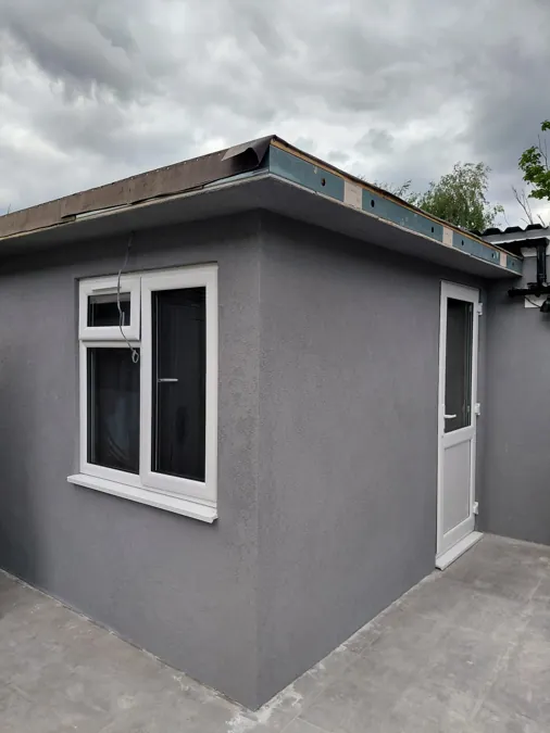 Grey textured K Rend finish on a house extension