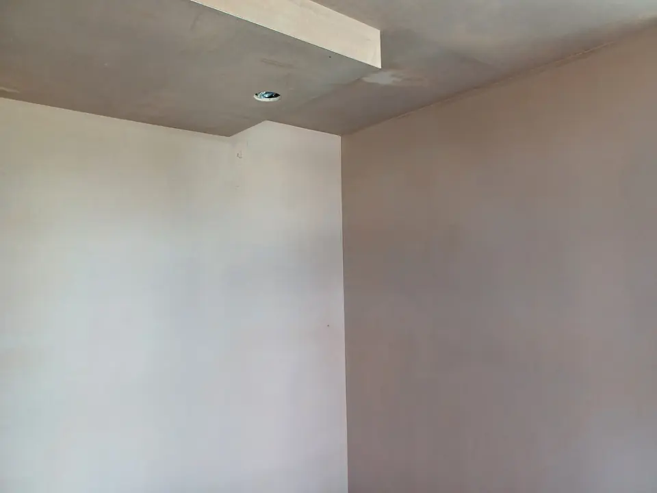Smooth plaster on the walls and ceiling of an interior room