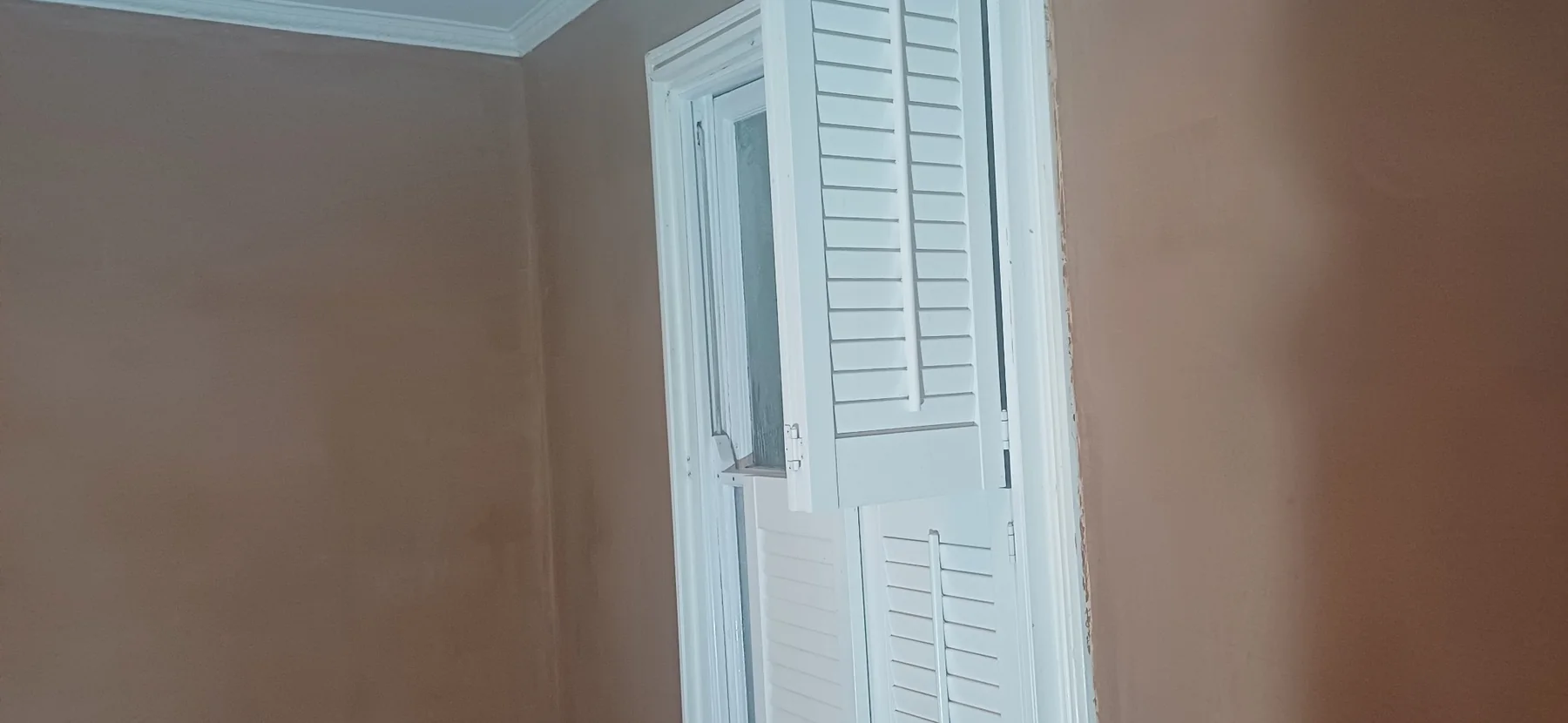 Freshly skimmed walls and ceiling in a Greenford flat